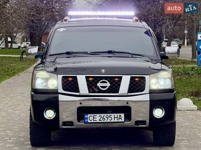 Черный Ниссан Армада, объемом двигателя 5.6 л и пробегом 267 тыс. км за 10999 $, фото 1 на Automoto.ua