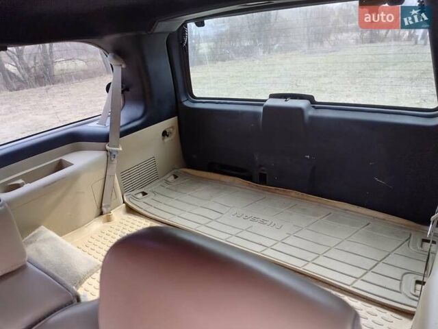 Черный Ниссан Армада, объемом двигателя 5.6 л и пробегом 255 тыс. км за 8000 $, фото 17 на Automoto.ua