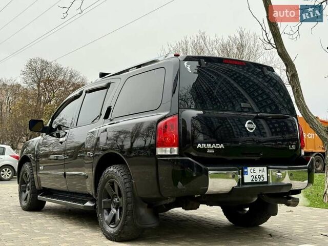 Черный Ниссан Армада, объемом двигателя 5.6 л и пробегом 267 тыс. км за 10999 $, фото 10 на Automoto.ua
