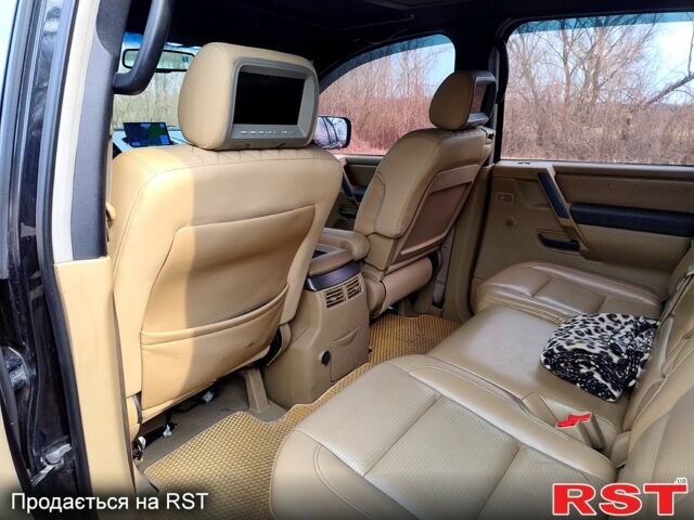 Черный Ниссан Армада, объемом двигателя 5.6 л и пробегом 255 тыс. км за 8000 $, фото 8 на Automoto.ua