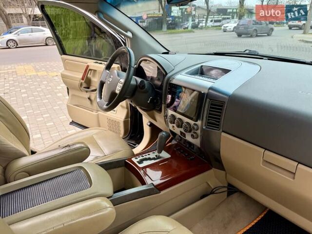 Черный Ниссан Армада, объемом двигателя 5.6 л и пробегом 267 тыс. км за 10999 $, фото 54 на Automoto.ua