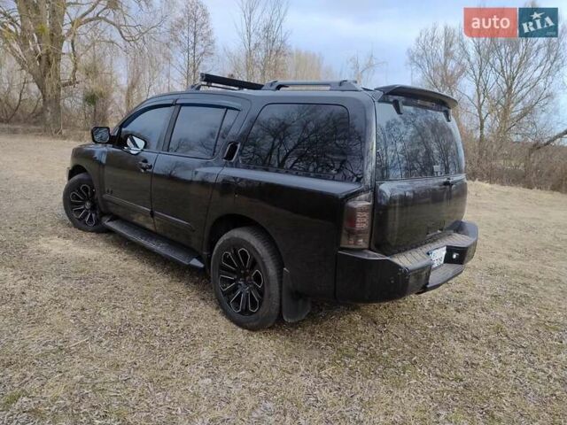 Черный Ниссан Армада, объемом двигателя 5.6 л и пробегом 255 тыс. км за 8000 $, фото 7 на Automoto.ua