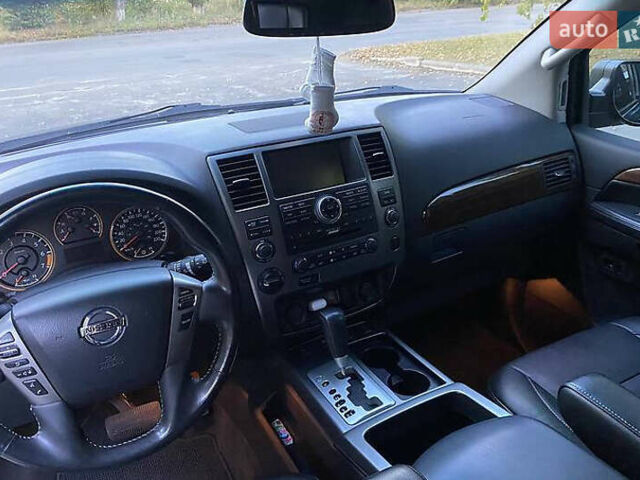 Синій Ніссан Armada, об'ємом двигуна 5.55 л та пробігом 126 тис. км за 15000 $, фото 9 на Automoto.ua