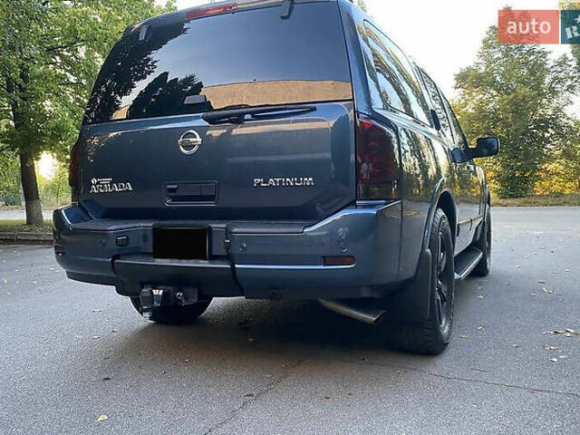 Синій Ніссан Armada, об'ємом двигуна 5.55 л та пробігом 126 тис. км за 15000 $, фото 3 на Automoto.ua