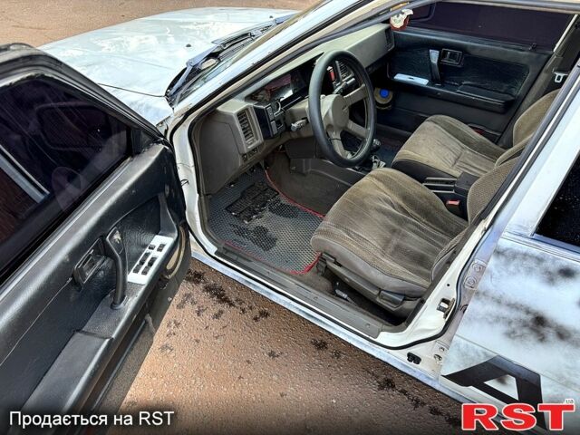 Белый Ниссан Блюберд, объемом двигателя 2 л и пробегом 200 тыс. км за 1050 $, фото 8 на Automoto.ua