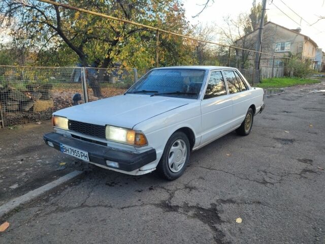 Белый Ниссан Блюберд, объемом двигателя 2 л и пробегом 300 тыс. км за 650 $, фото 2 на Automoto.ua