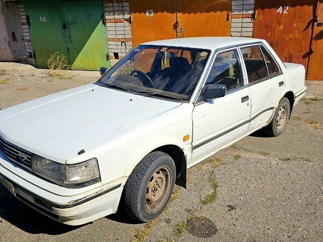 Белый Ниссан Блюберд, объемом двигателя 2 л и пробегом 172 тыс. км за 500 $, фото 2 на Automoto.ua