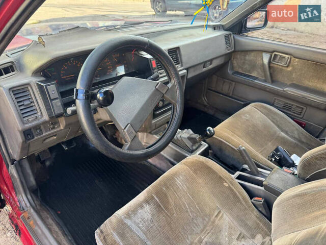 Красный Ниссан Блюберд, объемом двигателя 2 л и пробегом 300 тыс. км за 550 $, фото 6 на Automoto.ua