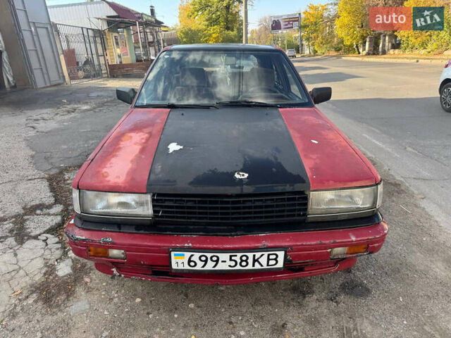 Красный Ниссан Блюберд, объемом двигателя 2 л и пробегом 300 тыс. км за 550 $, фото 2 на Automoto.ua