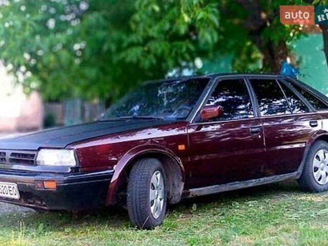 Красный Ниссан Блюберд, объемом двигателя 1.97 л и пробегом 400 тыс. км за 700 $, фото 1 на Automoto.ua