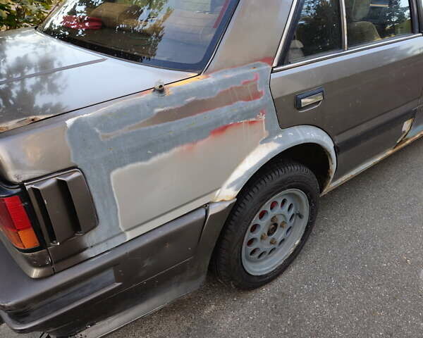 Серый Ниссан Блюберд, объемом двигателя 2 л и пробегом 300 тыс. км за 750 $, фото 5 на Automoto.ua