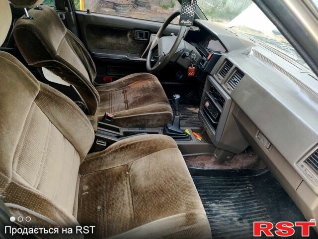 Серый Ниссан Блюберд, объемом двигателя 2 л и пробегом 250 тыс. км за 650 $, фото 4 на Automoto.ua