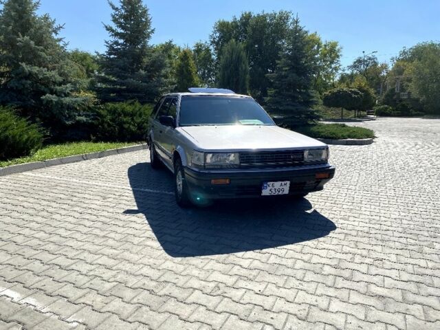 Сірий Ніссан Блюберд, об'ємом двигуна 2 л та пробігом 250 тис. км за 2000 $, фото 1 на Automoto.ua