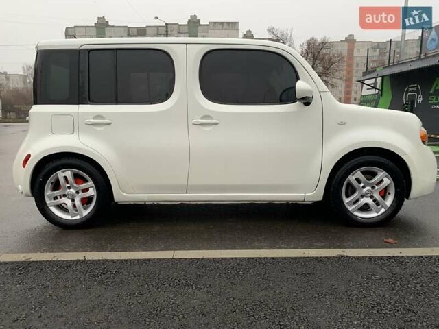 Белый Ниссан Куб, объемом двигателя 1.8 л и пробегом 195 тыс. км за 6000 $, фото 2 на Automoto.ua