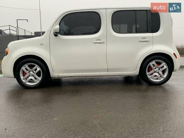 Белый Ниссан Куб, объемом двигателя 1.8 л и пробегом 195 тыс. км за 6000 $, фото 1 на Automoto.ua