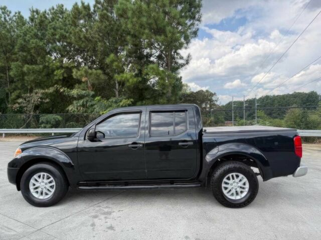 Черный Ниссан Фронтиер, объемом двигателя 4 л и пробегом 50 тыс. км за 25000 $, фото 4 на Automoto.ua