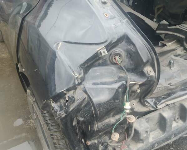 Черный Ниссан Жук, объемом двигателя 1.6 л и пробегом 200 тыс. км за 4800 $, фото 1 на Automoto.ua