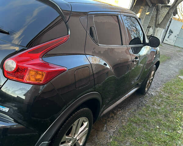 Черный Ниссан Жук, объемом двигателя 1.46 л и пробегом 158 тыс. км за 8250 $, фото 2 на Automoto.ua