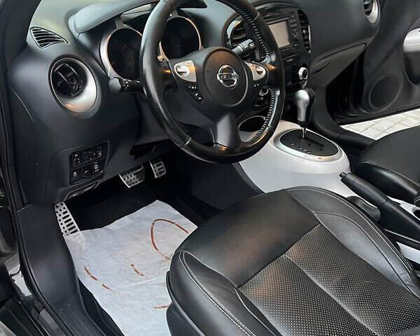 Черный Ниссан Жук, объемом двигателя 1.6 л и пробегом 190 тыс. км за 10850 $, фото 28 на Automoto.ua