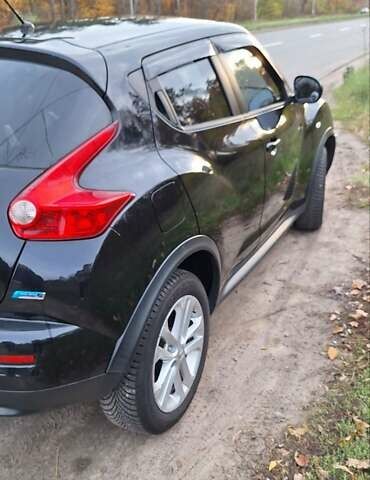 Черный Ниссан Жук, объемом двигателя 1.6 л и пробегом 170 тыс. км за 11000 $, фото 6 на Automoto.ua