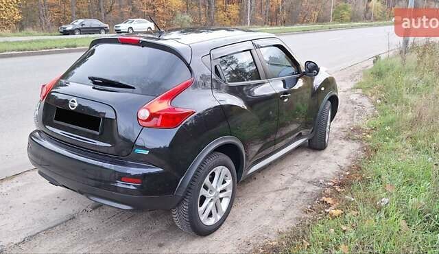 Черный Ниссан Жук, объемом двигателя 1.6 л и пробегом 170 тыс. км за 11000 $, фото 9 на Automoto.ua