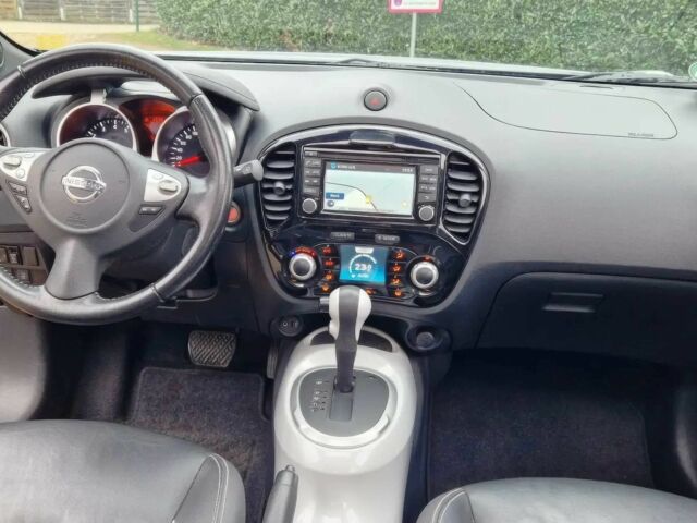 Черный Ниссан Жук, объемом двигателя 1.6 л и пробегом 76 тыс. км за 8000 $, фото 7 на Automoto.ua