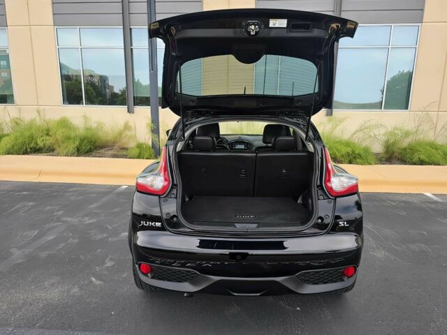 Черный Ниссан Жук, объемом двигателя 1.6 л и пробегом 70 тыс. км за 10000 $, фото 13 на Automoto.ua