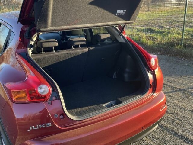 Червоний Ніссан Жук, об'ємом двигуна 1.6 л та пробігом 105 тис. км за 11300 $, фото 13 на Automoto.ua