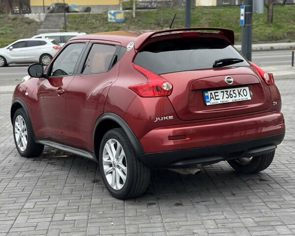 Червоний Ніссан Жук, об'ємом двигуна 1.6 л та пробігом 145 тис. км за 7700 $, фото 2 на Automoto.ua