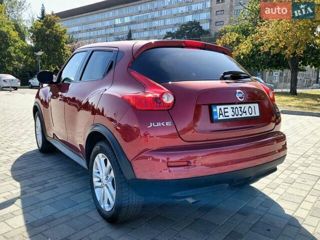 Червоний Ніссан Жук, об'ємом двигуна 1.62 л та пробігом 150 тис. км за 8699 $, фото 2 на Automoto.ua