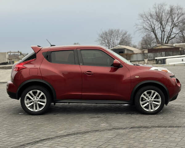 Червоний Ніссан Жук, об'ємом двигуна 1.6 л та пробігом 145 тис. км за 7700 $, фото 5 на Automoto.ua