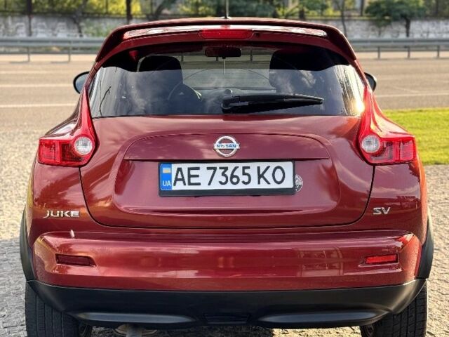 Красный Ниссан Жук, объемом двигателя 1.6 л и пробегом 90 тыс. км за 7999 $, фото 5 на Automoto.ua