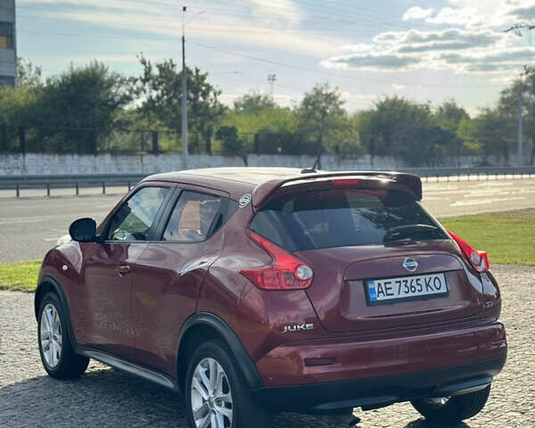 Красный Ниссан Жук, объемом двигателя 1.6 л и пробегом 144 тыс. км за 7899 $, фото 6 на Automoto.ua