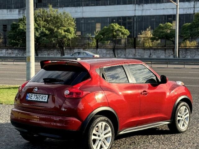 Красный Ниссан Жук, объемом двигателя 1.6 л и пробегом 90 тыс. км за 7999 $, фото 4 на Automoto.ua