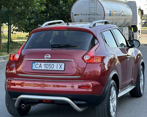 Красный Ниссан Жук, объемом двигателя 1.6 л и пробегом 198 тыс. км за 8300 $, фото 7 на Automoto.ua