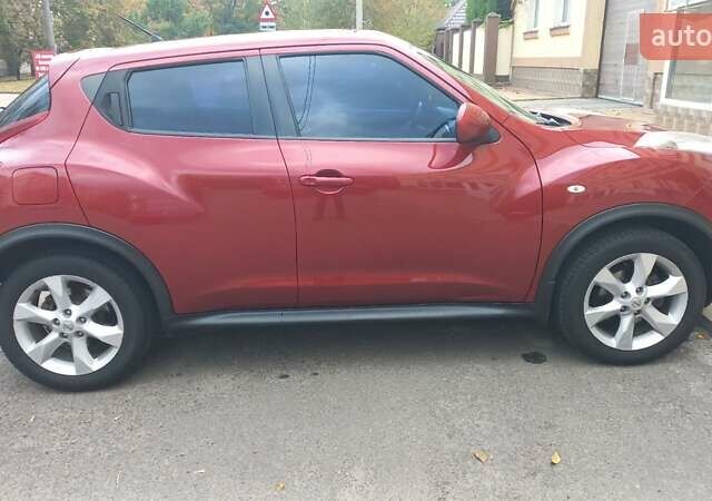 Червоний Ніссан Жук, об'ємом двигуна 1.6 л та пробігом 199 тис. км за 9700 $, фото 7 на Automoto.ua