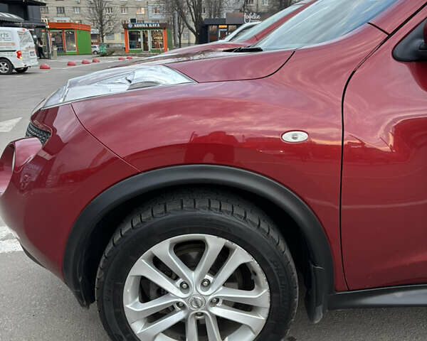 Червоний Ніссан Жук, об'ємом двигуна 1.6 л та пробігом 127 тис. км за 9700 $, фото 14 на Automoto.ua