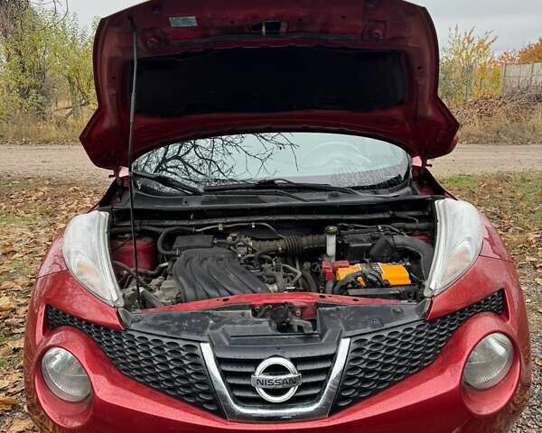Червоний Ніссан Жук, об'ємом двигуна 1.6 л та пробігом 211 тис. км за 10500 $, фото 8 на Automoto.ua