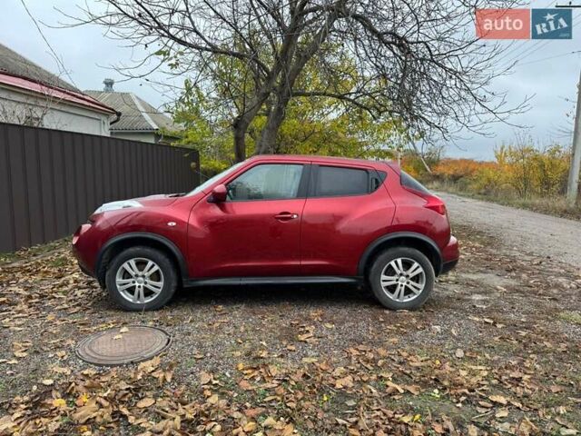 Червоний Ніссан Жук, об'ємом двигуна 1.6 л та пробігом 211 тис. км за 10500 $, фото 3 на Automoto.ua