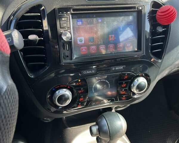 Красный Ниссан Жук, объемом двигателя 1.6 л и пробегом 125 тыс. км за 9700 $, фото 10 на Automoto.ua