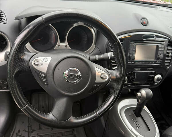 Червоний Ніссан Жук, об'ємом двигуна 1.6 л та пробігом 166 тис. км за 9600 $, фото 6 на Automoto.ua