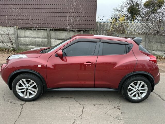 Красный Ниссан Жук, объемом двигателя 1.6 л и пробегом 214 тыс. км за 9000 $, фото 1 на Automoto.ua