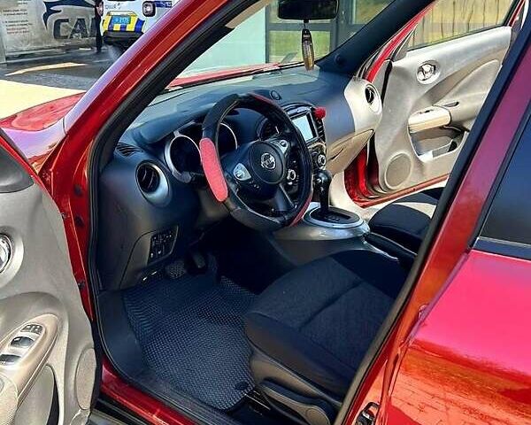Червоний Ніссан Жук, об'ємом двигуна 1.6 л та пробігом 125 тис. км за 9700 $, фото 6 на Automoto.ua