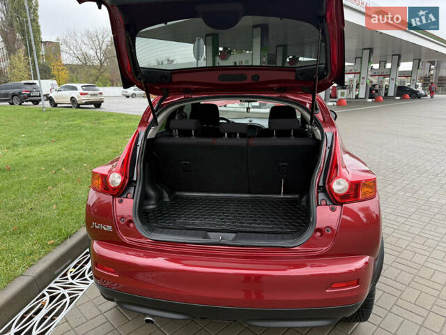 Червоний Ніссан Жук, об'ємом двигуна 1.6 л та пробігом 151 тис. км за 9900 $, фото 15 на Automoto.ua