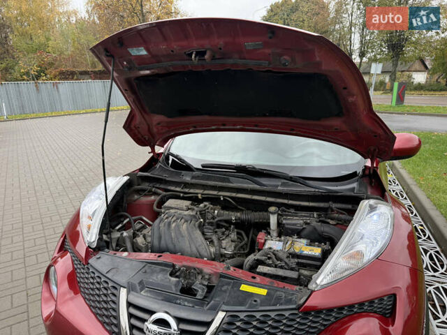 Червоний Ніссан Жук, об'ємом двигуна 1.6 л та пробігом 151 тис. км за 9900 $, фото 9 на Automoto.ua