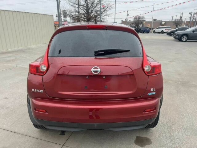 Червоний Ніссан Жук, об'ємом двигуна 1.6 л та пробігом 80 тис. км за 12600 $, фото 5 на Automoto.ua