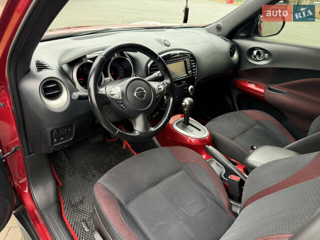 Червоний Ніссан Жук, об'ємом двигуна 1.6 л та пробігом 151 тис. км за 9900 $, фото 13 на Automoto.ua