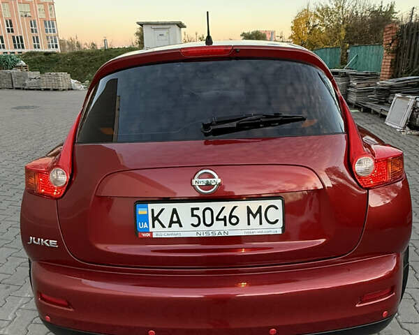 Червоний Ніссан Жук, об'ємом двигуна 1.6 л та пробігом 54 тис. км за 11800 $, фото 5 на Automoto.ua