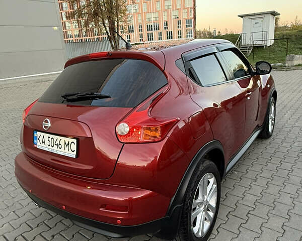 Червоний Ніссан Жук, об'ємом двигуна 1.6 л та пробігом 54 тис. км за 11800 $, фото 4 на Automoto.ua