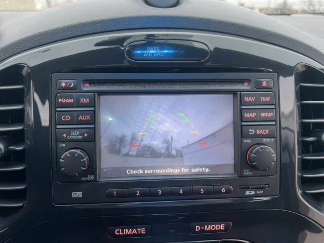 Червоний Ніссан Жук, об'ємом двигуна 1.6 л та пробігом 80 тис. км за 12600 $, фото 10 на Automoto.ua